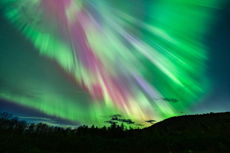 A mind-blowing, spectacular sight of the Corona of the Aurora Borealis engulfs the night sky over Maine